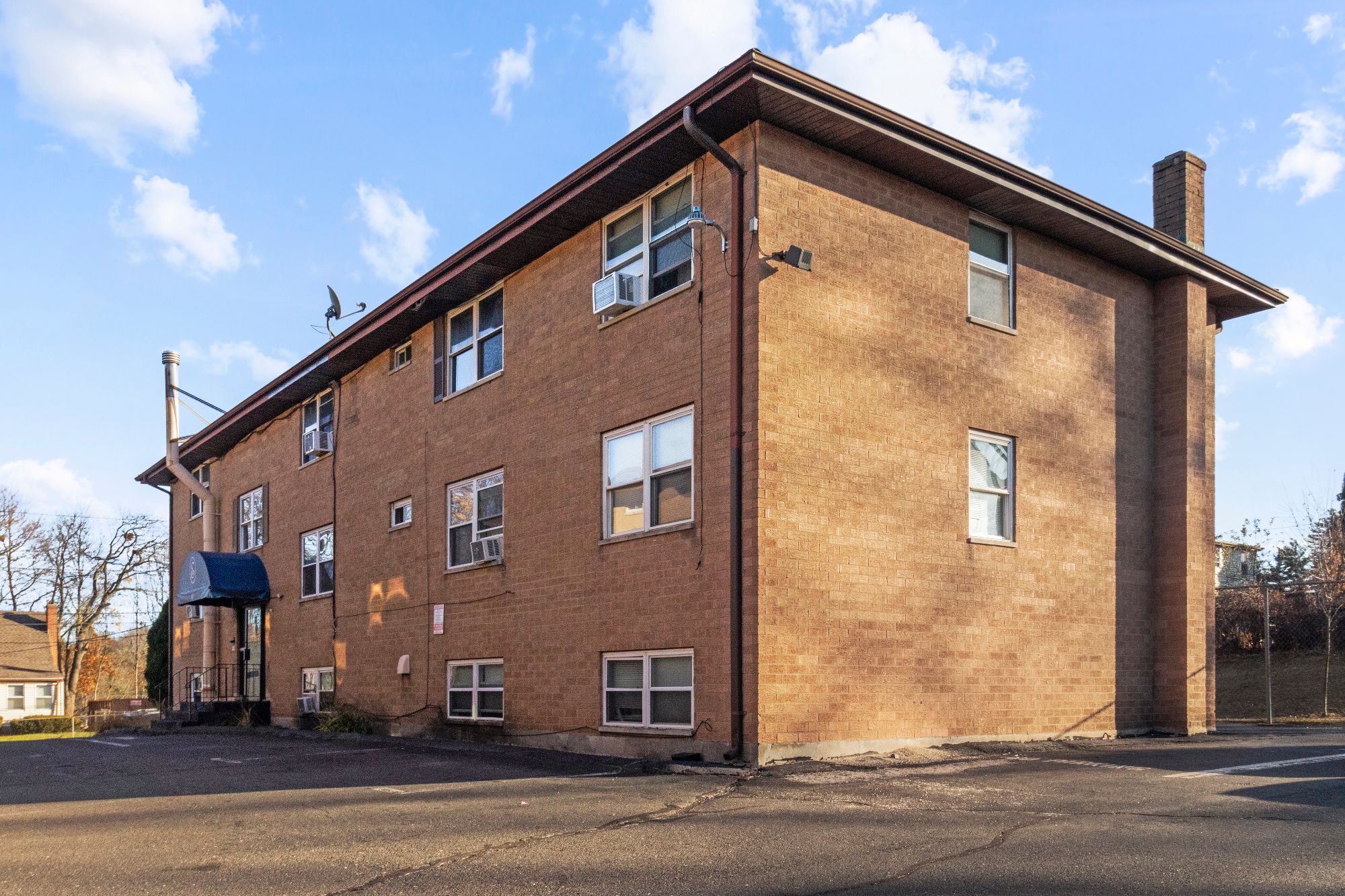 Brick exterior of 45 Elam Street with resident parking