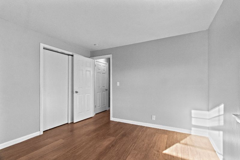 Bedroom with closet and door