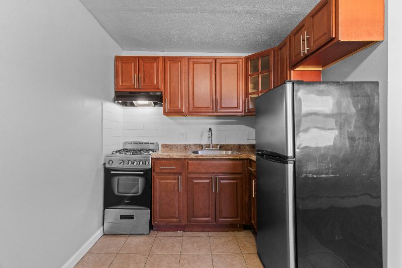 Kitchen with wood cabinets and gas range